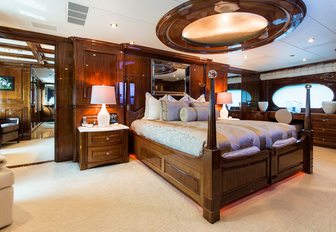 large bed under a skylight in the main salon of superyacht Remember When