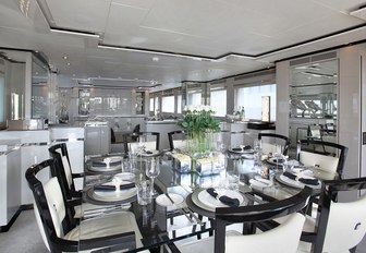 chic dining area with glass dining table aboard motor yacht SEALYON 