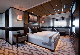 full-beam master suite with carpets inspired by tyre treads on board charter yacht AURELIA