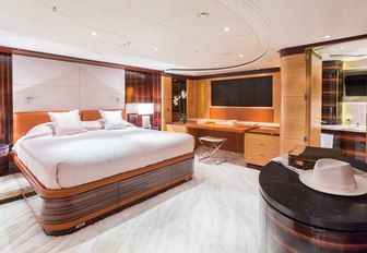 master suite with large bed on board charter yacht Q