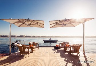 invictus yacht swim platform with parasols and seating