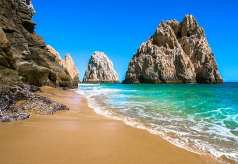 beautiful white sand beach with turquoise waters and dramatic rock formations in the Baja Peninsula, Mexico