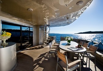 chic alfresco dining area on aft deck of charter yacht PANDION 