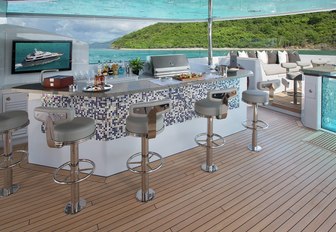 sleek bar next to Jacuzzi on the sundeck of motor yacht Muchos Mas