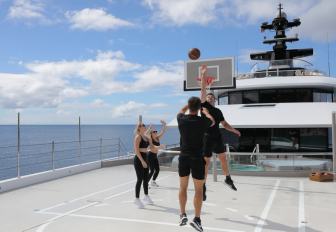Superyacht charter WHISPER charter guests playing basketball