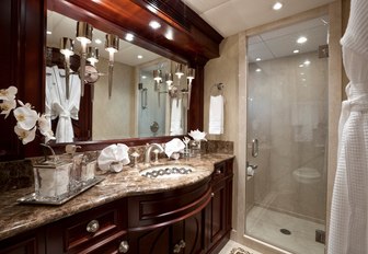 master's en suite on luxury yacht alessandra, with marble surfaces and elegant details