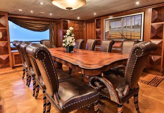 grand dining area in the main salon of motor yacht DENIKI 