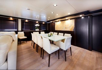 Superyacht GATSBY dining area with table and dark walls