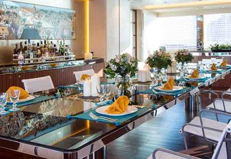 formal dining area in the main salon of superyacht AQUIJO