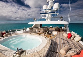 spa pool surrounded by sun pads on the sundeck of luxury yacht Remember When