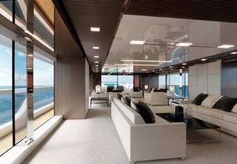 The floor to ceiling windows and sofa seating on board luxury yacht Seven Sins