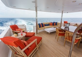 alfresco dining and lounge options on main deck aft of charter yacht 'Chasing Daylight'