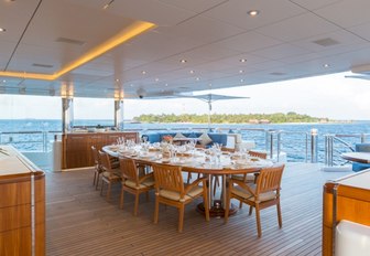 alfresco dining area on the upper deck aft of superyacht WHEELS