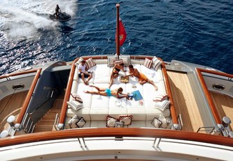 charter guests relax on sun pads aboard superyacht TV