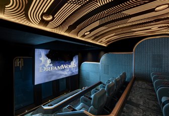 Superyacht charter KISMET indoor cinema with teal seats