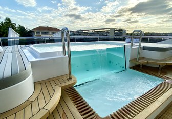 pool on sundeck of superyacht babas during bahamas charter show as seen in bay street marina