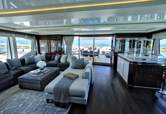 relaxed skylounge with seating and bar aboard luxury yacht Take 5