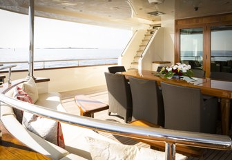 alfresco dining area on the aft deck of charter yacht Beverley