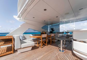 Luxury yacht charter CAPTAIN MORGAN III sundeck with wet bar and sofa