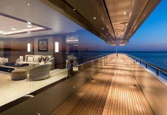 Side decks of Superyacht LANA with glass window showing interiors