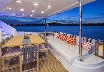 alfresco dining and lounge area on aft deck of motor yacht Alandrea