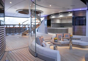 seating area with bar beyond on sundeck of luxury yacht KISMET 