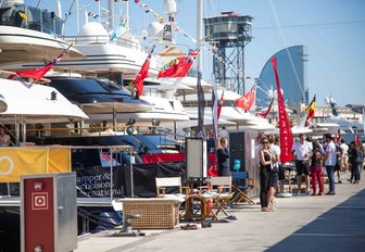 yachts line up along the boardwalks adorned in bunting in Barcelona, Spain, for the MYBA Charter Show