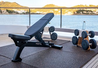 Gym equipment with view of sea onboard charter yacht LIV LOVE