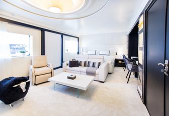 light and airy stateroom aboard luxury yacht SALUZI with seating area