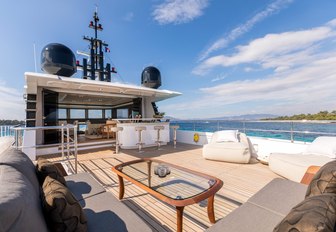 seating and bar area on the large flybridge aboard luxury yacht ONEWORLD 