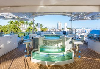 custom-made Jacuzzi with waterfall feature and swim-up bar on board charter yacht ‘King Baby’ 