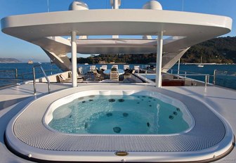 The Jacuzzi and alfresco dining table on board superyacht Reve d'Or