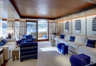 The decor of the salon annexing the exterior of superyacht SYMPHONY