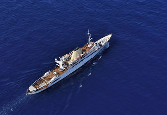 Aerial shot of luxury superyacht Christina O sailing deep blue water 