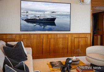 Charter yacht AQUA LARES interior seating area with TV on wall