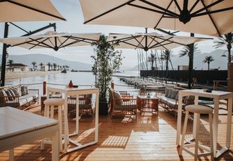 teak decking with chairs looking out over the water at PMYC Beach in Montenegro