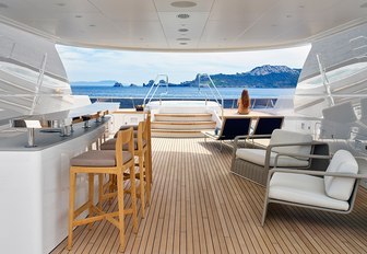 sleek bar and Jacuzzi on the sundeck of charter yacht ASYA 