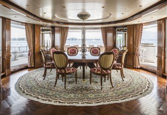 magnificent circular dining area on the bridge deck aft of motor yacht TITANIA 