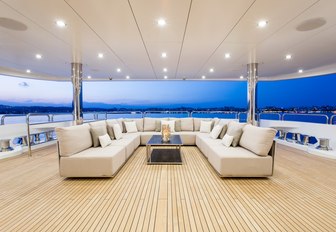 U-shaped sofa and coffee table on main deck aft of motor yacht BLUSH 