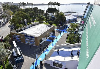 aerial view of MIPIM with attendees on blue carpet outside Palais des Festivals