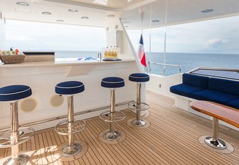 the sundeck of charter yacht all in is fit with all the luxury amenties that a charter guest might need to enjoy their luxury yacht charter vacation in the bahamas