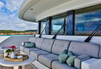 foredeck seating area with table on board superyacht DENIKI 