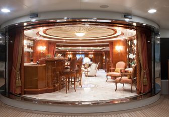 baroque-style main salon with bar and lounge beyond on board superyacht St David