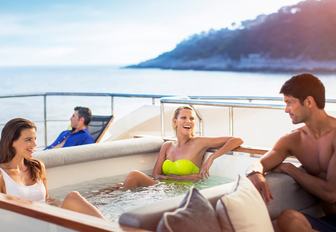 Charter guests relax in jacuzzi