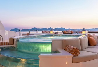 spa pool with cascading waterfall feature lit up on the sundeck of luxury yacht Lucky Lady 