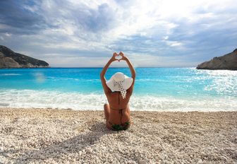 woman doing yoga on a beach in Lefkada, Greece