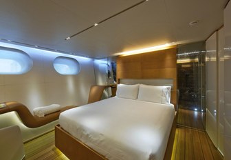 owners cabin with porthole windows and discreet lighting on sailing charter yacht panthalassa