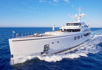 motor yacht 11/11 cuts through the water of a private yachting vacation