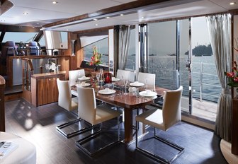 Formal dining on board luxury yacht 'Aqua Libra'