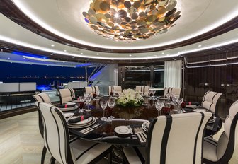 formal dining area in indoor-outdoor area on board motor yacht OKTO